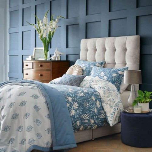Parterre print, Laura Ashley. White flowers and leaves in a garland, sea blue. Breathable pure cotton. Reversible.