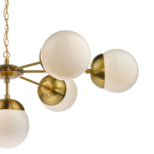 Lámpara de techo inspiración s.XX, con globos de vidrio sobre estructura bronce natural estilo satélite y cadena regulable.