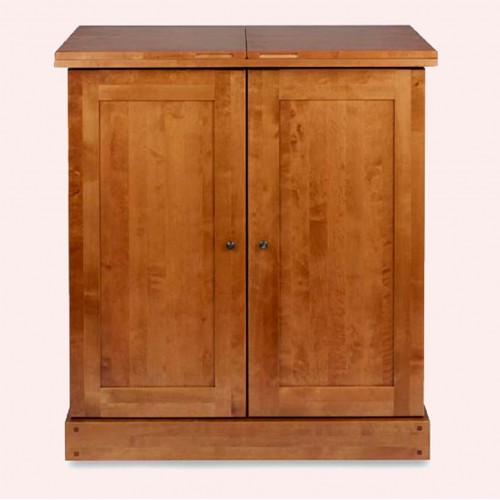 Liquor cabinet, solid wood. Honey finish. Two doors, hinged lid and mirrored interior. Garrat, Laura Ashley.