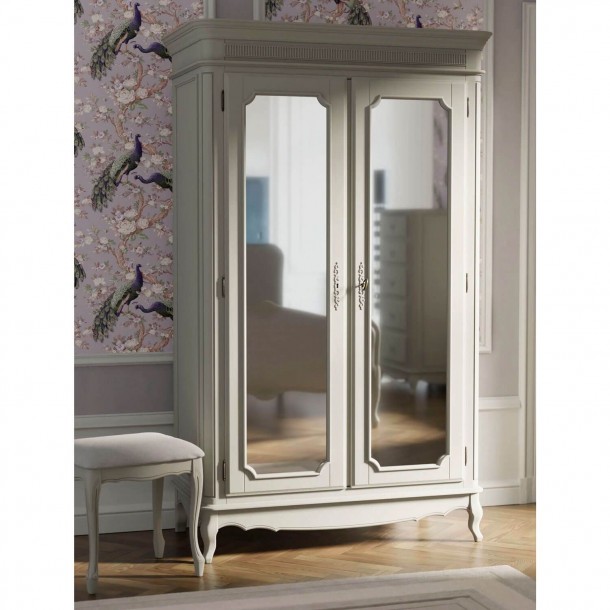 Laura Ashley wardrobe with 2 mirrored doors, 2 shelves and bar. Gray finish with patina. Contoured legs, and carved details.