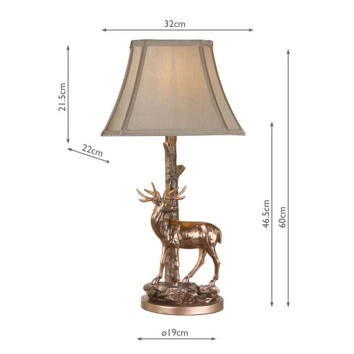 Lámpara de mesa Gulliver Deer con base de ciervo en bronce envejecido y pantalla tipo seda en dorados con remate a juego.