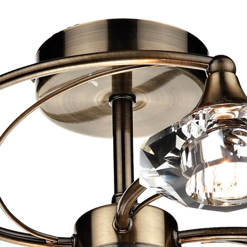 Lámpara de techo con 6 puntos de luz, semi empotrada en bronce envejecido con pantalla de cristal facetado.