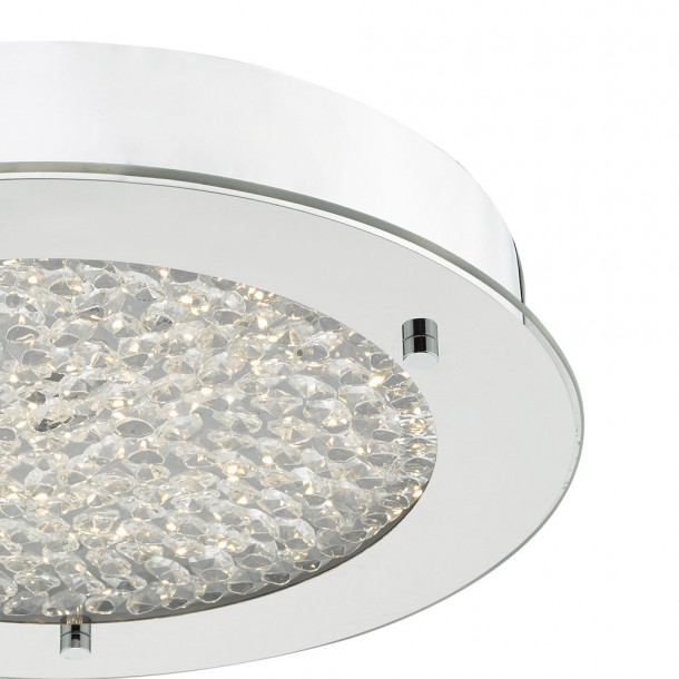 Lámpara Peta acabada en cromo pulido y cristal texturizado. Perfecta para el baño con IP44. Incluye bombilla LED blanca cálida.