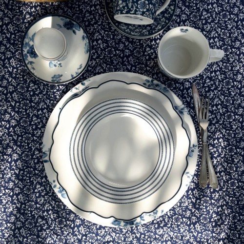 Blueprint jagged rim porcelain plate, Laura Ashley. Diameter 24.5 cm, white and blue, dishwasher safe.
